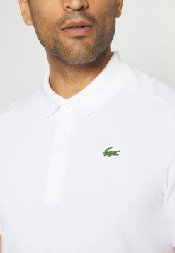 Lacoste Sport Golf - Poloshirt - Blanc/Blanc -Charmant Golfen Winkel 6da08dc7e795443b8f6d26b53741a951