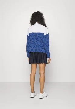 PUMA Golf Hoops Golf Jacket - Windjack - Clyde Royal/White Glow -Charmant Golfen Winkel 82cf58e104184e28a66080bffde5bc47