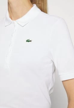 Lacoste Sport Golf - Poloshirt - Blanc -Charmant Golfen Winkel d5584deaa8ee4b31941f5a002ae4adfb